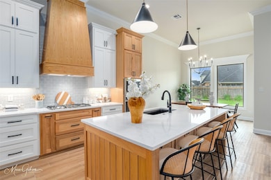 Kitchen featuring light wood-type flooring, custom