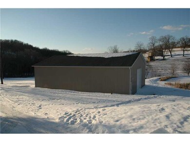 Land. 40x60 barn has 2-12 foot doors and concrete 