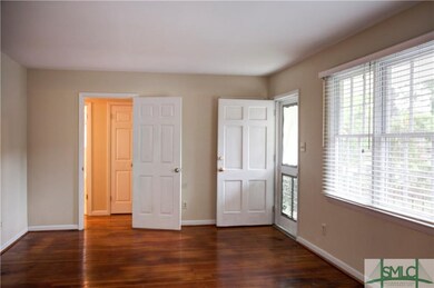 Living Room has beautiful hardwood flooring and lo