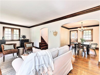 * LIVING ROOM OPEN TO FORMAL DINING ~