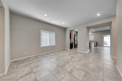 Unfurnished room with light tile patterned flooring and recessed lighting
