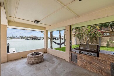 View of patio / terrace featuring a fire pit, a w