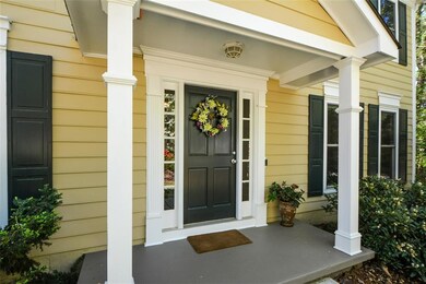 Property entrance with covered porch