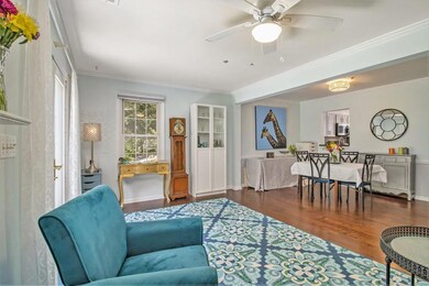 The dining area flows seamlessly into the fireside living room, with French doors that open to your very own private garden retreat truly a backyard oasis like no other townhome!