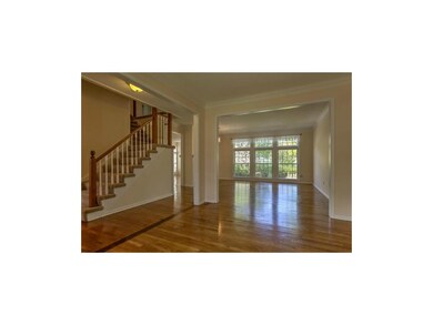 Formal living room looking in to family room. Lots