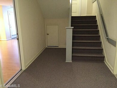 Entry. Entry from front entrance. Area is carpeted and is used by 4 different units on main floor.