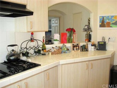 Ceramic tile counters, easy care laminate cabinets