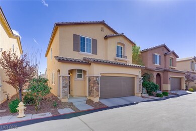 Mediterranean / spanish house featuring a garage,