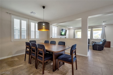 Tiled dining space with baseboards