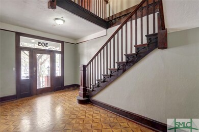 Large foyer with gorgeous flooring.