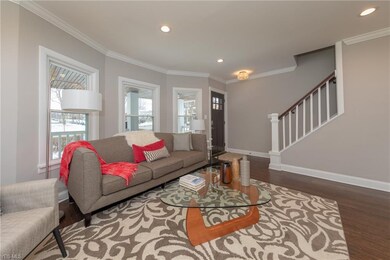 A view of the Living Room, high-lighting the bay window and new mission style front door