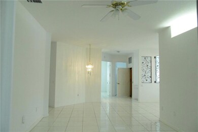 LIVING ROOM LOOKING UPSTAIRS ENTRANCE