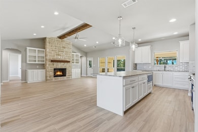 Open concept kitchen, living room, and dining area