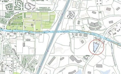 View of asphalt street featuring sidewalks and curbs