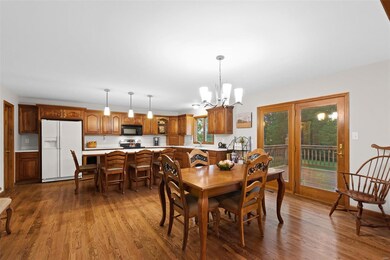 Spacious kitchen and dining room with hardwood flo