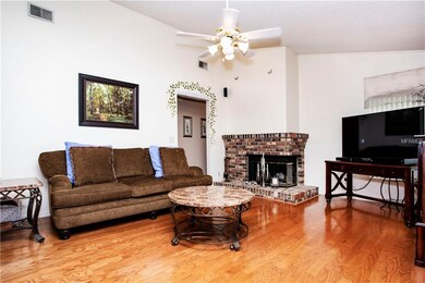 pretty corner fireplace in the family room with co