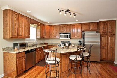 Highly functional kitchen with window overlooking back yard.  Stainless appliances, granite countertops, and upgraded light fixtures just to name a few of the amenities in this eat-in kitchen,