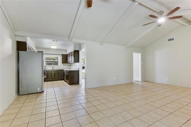 Great Room, with view of Kitchen. Foyer in back