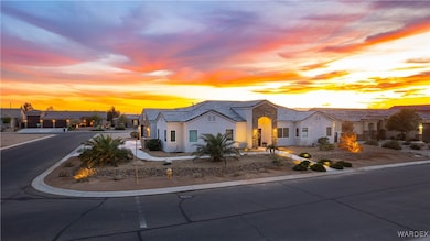 View of front of property featuring driveway, a ti