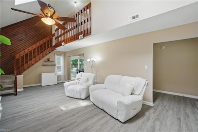 Living Room with cathedral ceiling and LVP floorin