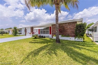 Ranch-style home featuring driveway, a front lawn,