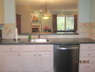 Kitchen looking into living room
