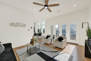 2nd floor boasts a spacious living area and gourmet kitchen with high-end finishes and trendy design