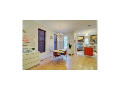 Delightful dining area with whimsical modern light
