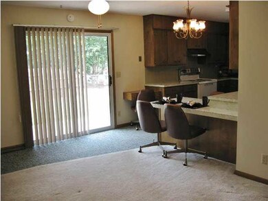 Open kitchen/dining combination. Notice the slidin