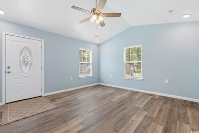 Foyer with plenty of natural light, ceiling fan, a