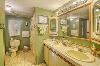 Bathroom featuring toilet, a textured ceiling, and