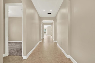 Front hallway with tray ceiling