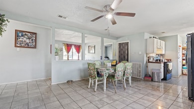 another angle of the kitchen and dining combo