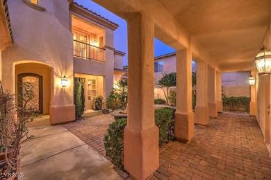 View of patio with a balcony