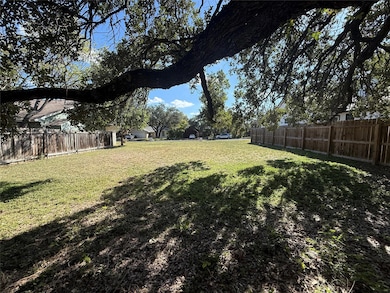 View of fenced backyard