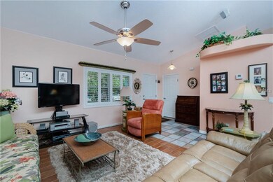 High ceilings, plant shelves make this room super inviting