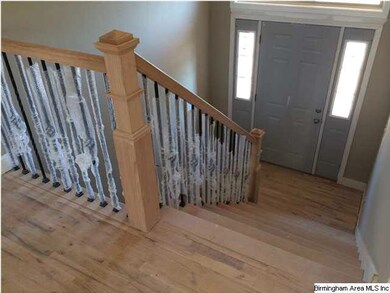 Nice foyer with wood floors and steps, the wood fl