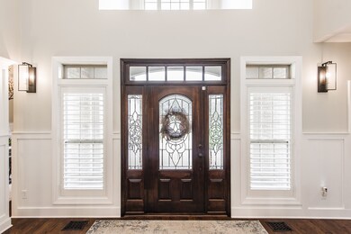 The foyer is bright and open with updated wall sconces!