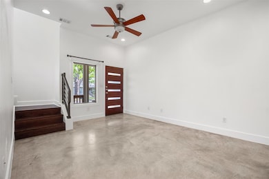 Unfurnished room featuring baseboards, stairs, vi