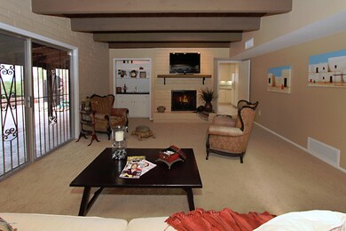 Family Room w/Fireplace & Beamed Ceiling