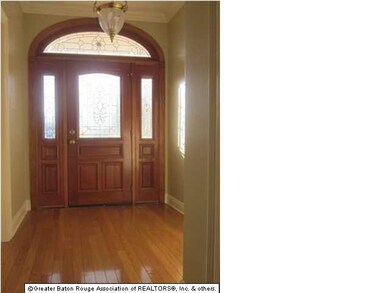 Beautiful foyer with wood floors