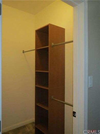 Walk-in closet in master with organizer
