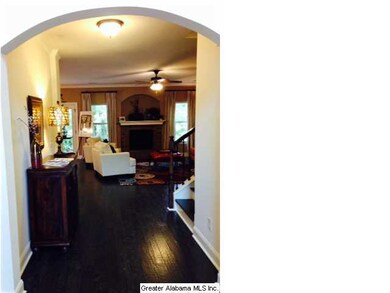 GRAND 2 STORY ENTRYWAY FEATURES HARDWOODS AND ARCH