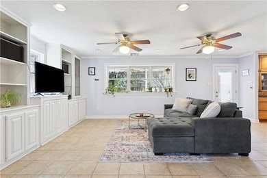 Living Room with Built in's and large window overlooking the backyard