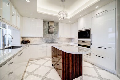 The kitchen features Wolf appliances and a Sub-Zer