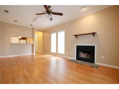 Unfurnished living room featuring ornamental mold