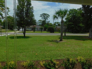 View of community featuring a yard