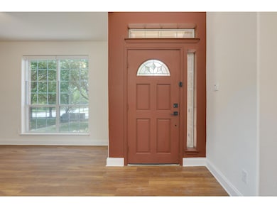 Entrance foyer featuring wood finished floors and