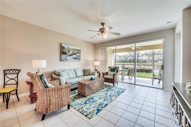 Living room featuring ceiling fan, baseboards, and