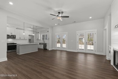 Living Room w/ Fireplace & Built-Ins